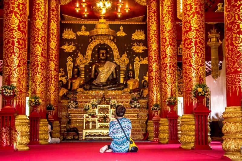 All red and golden temple in Thailand while backpacking through Southeast Asia