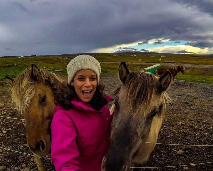 Nina with two horses in Iceland