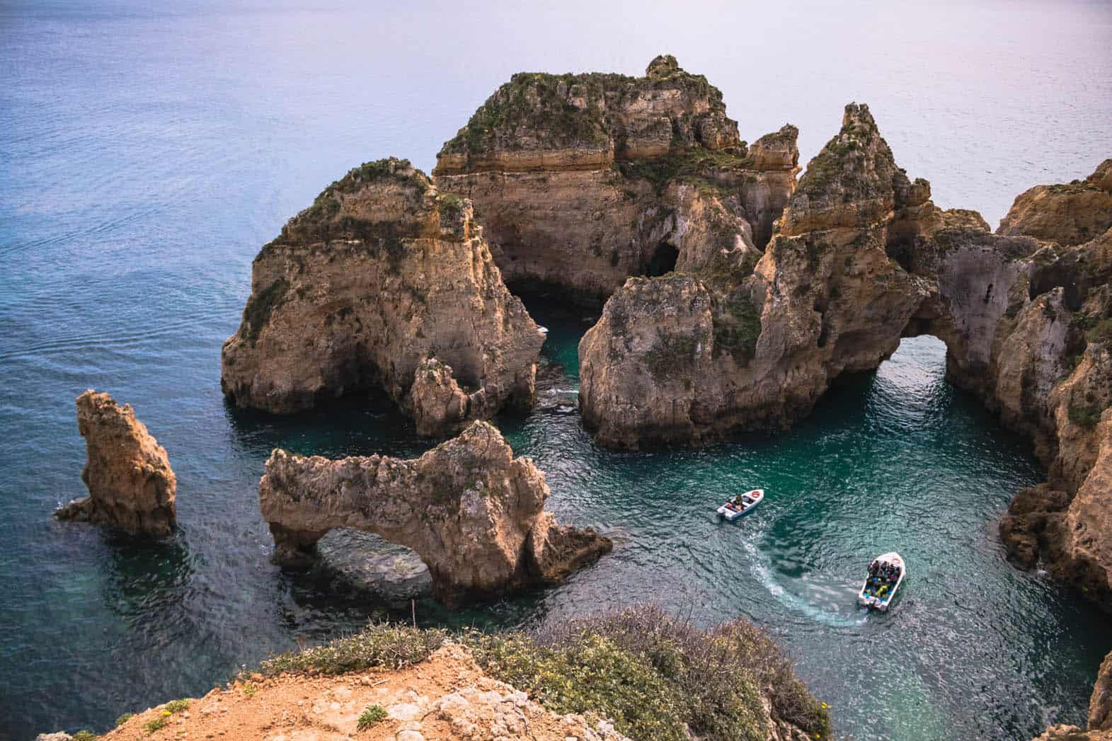 Ponta da Piedade in Portugal, awesome view of rocky cliffs and two boats.