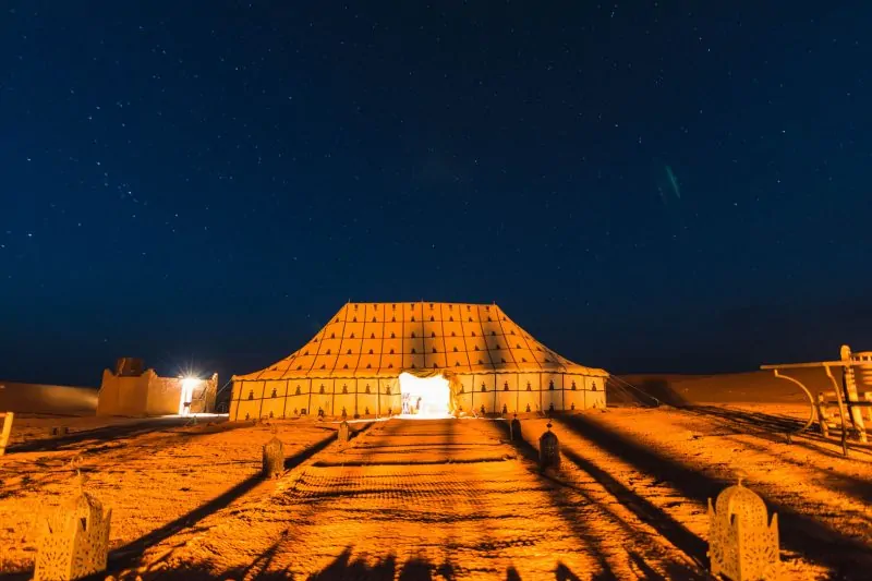 A night shot of our Morocco desert tour campsite.