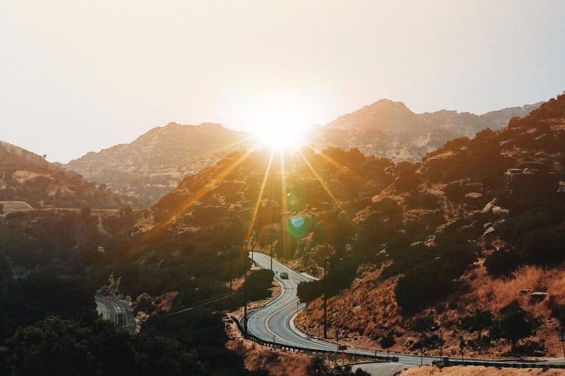 sunset over a mountain road