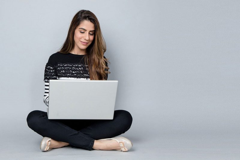 woman behind a laptop