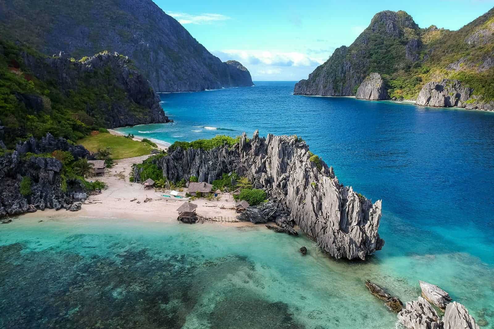 Star beach El Nido Philippines from above with stunning cliffs and blue water.
