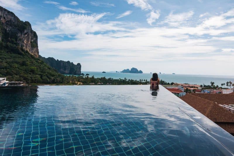 Nina chilling in an infinity pool at Ao Nang Cliff Beach resort looking out over Krabi and the Ocean.
