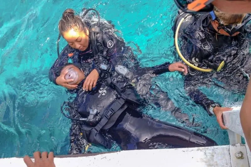 Scuba instructor practicing rescue