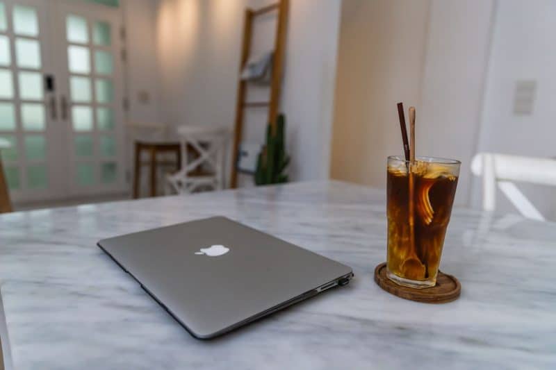 closed laptop on table representing how to become a digital nomad 