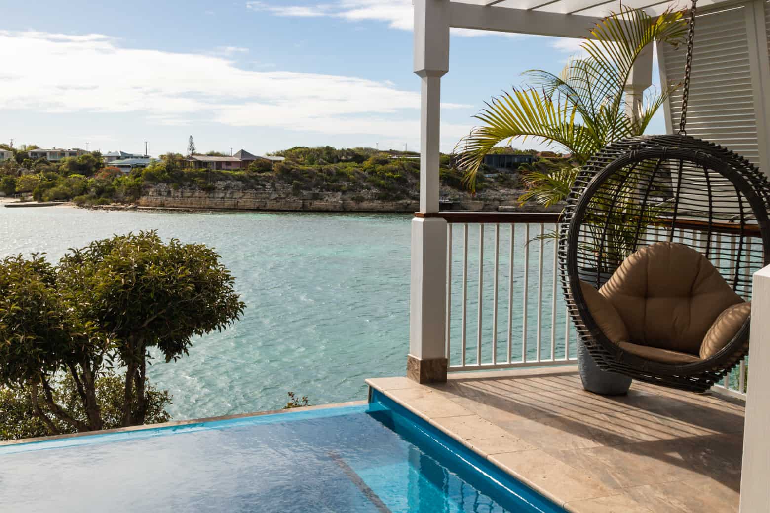 Private pool and hammock chair overlooking the oceans at Hammock Cove's all inclusive adult-only Antigua resort.