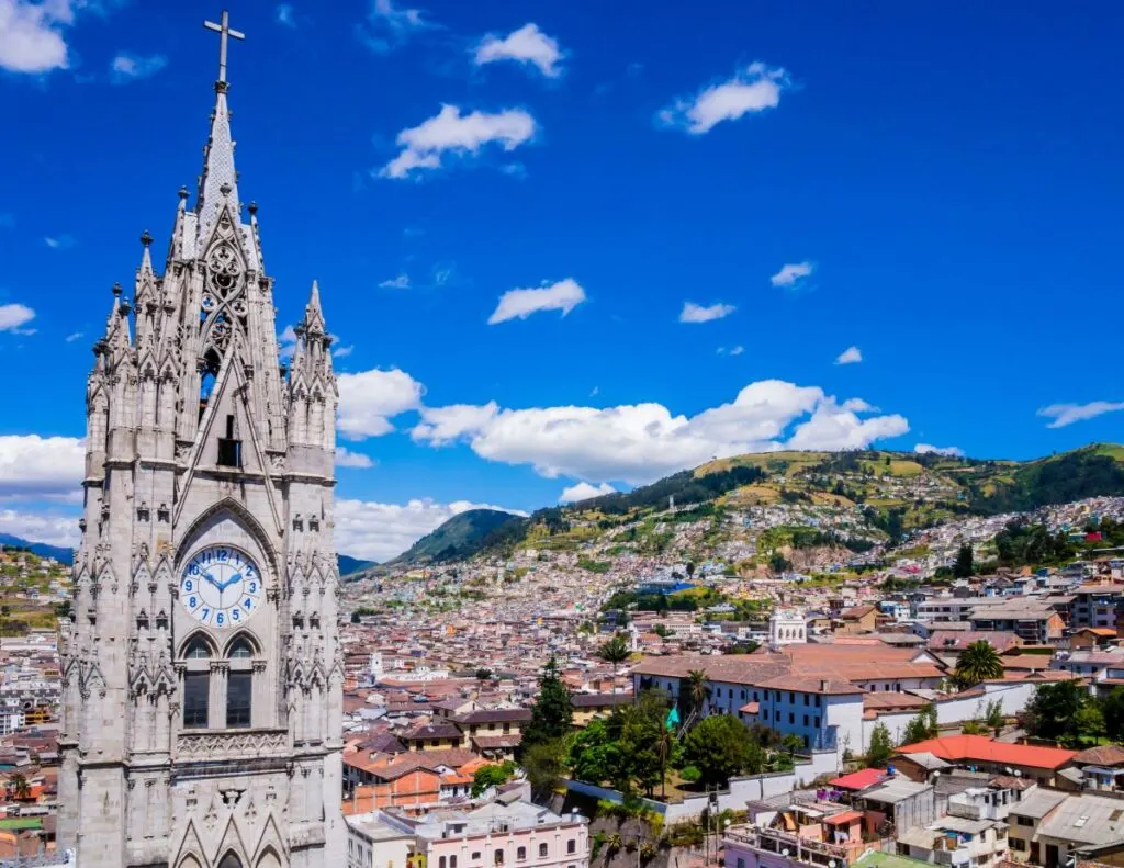 See the Gothic Basilica Del Voto Nacional Clock Tower in Ecuador.