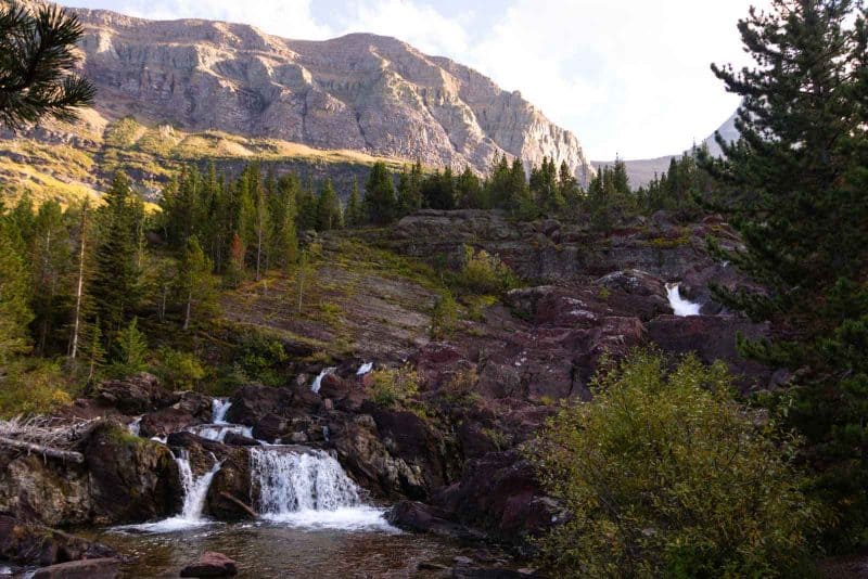 Don't miss Red Rocks Falls during a hike in Glacier National Park