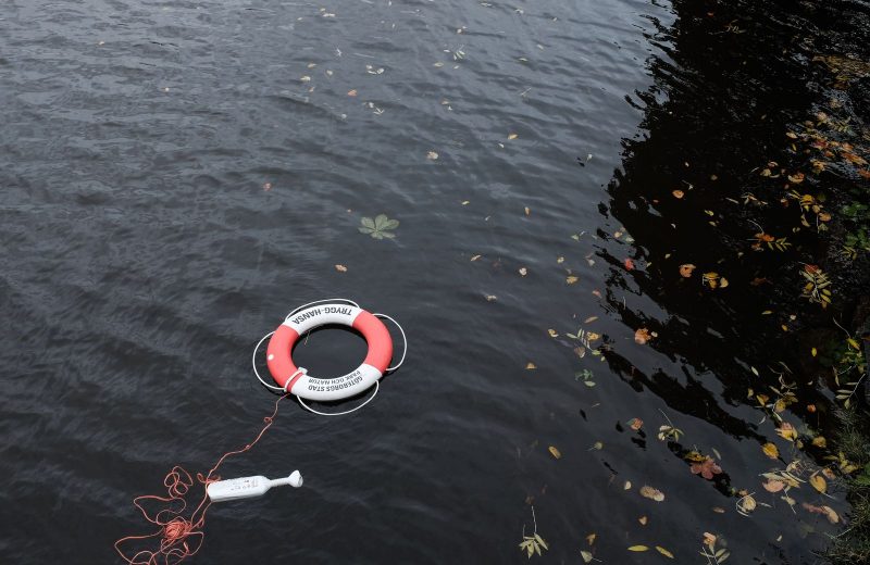 A buoy which demonstrate getting rescued which is included in some long term travel insurance plans