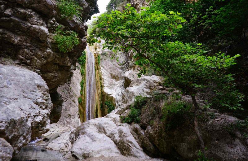 Dimossari Waterfalls are a fun place to visit on your Greek island hopping routes.