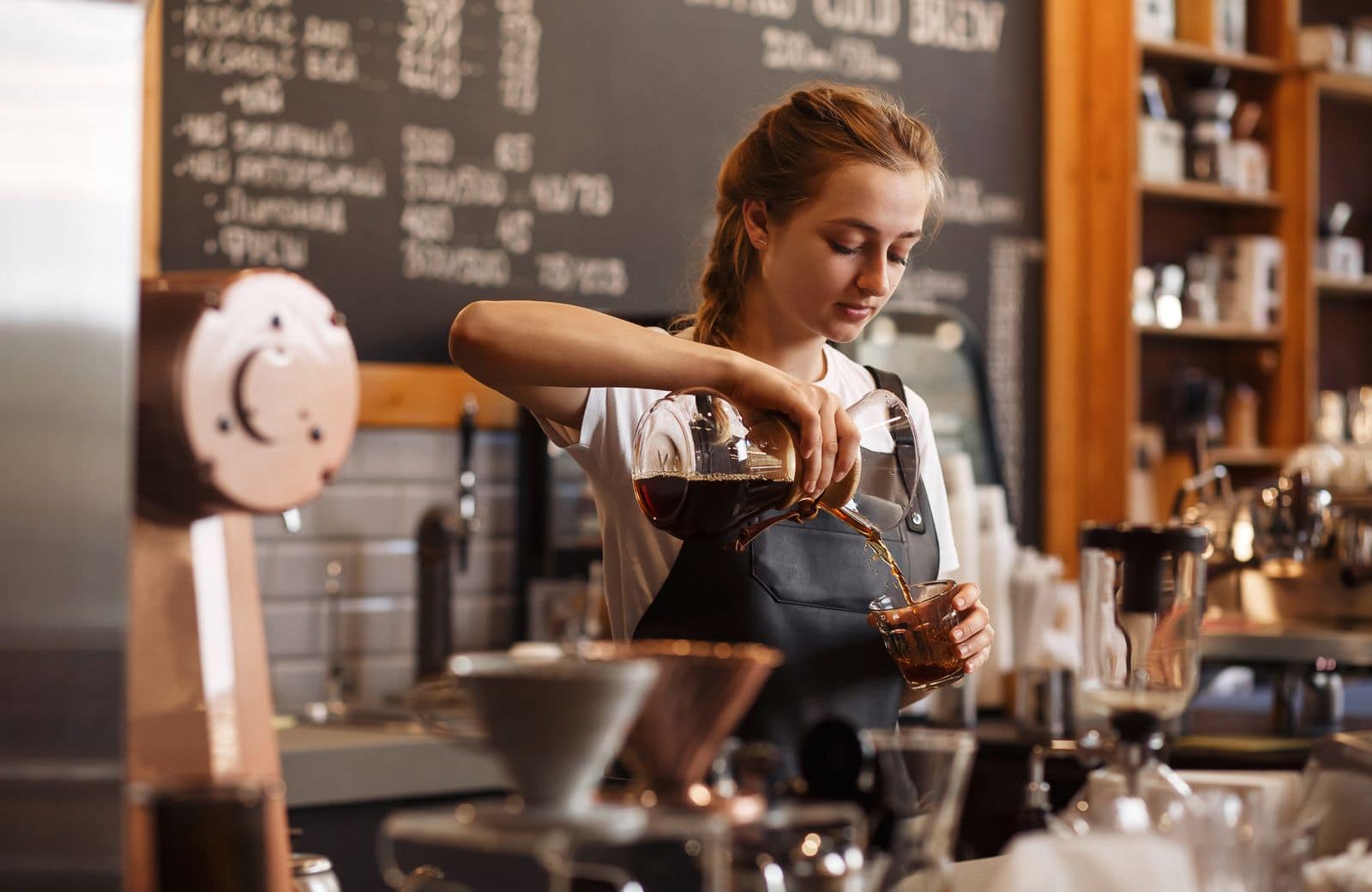 worker in coffee shop, a popular working holiday visa job.