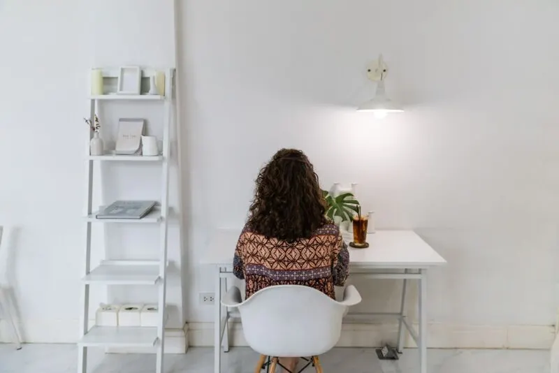 Woman working at desk in co-working space while living in Thailand