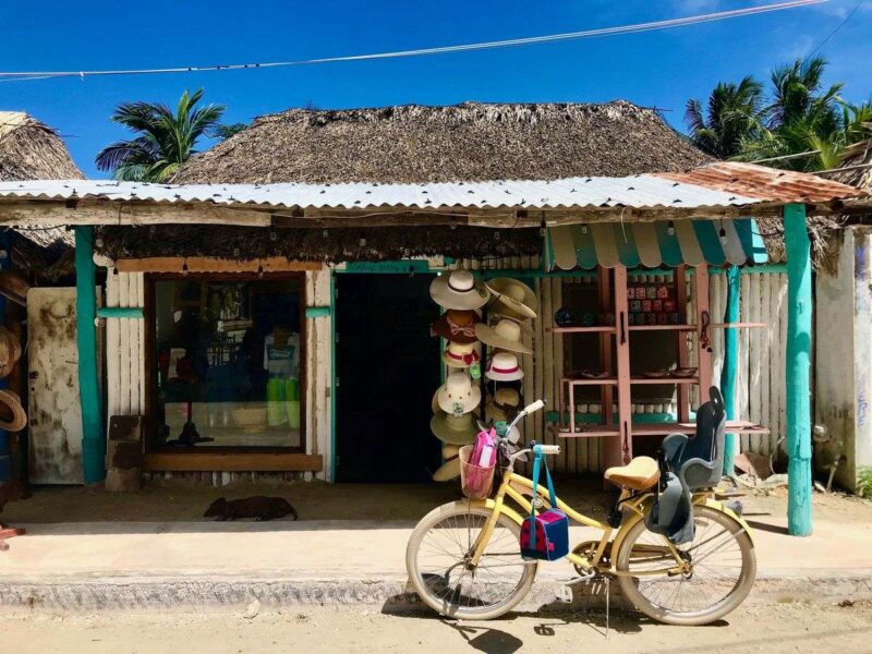 Bike parked in front of beach shack in Isla Holbox, a must for your Yucatan Itinerary