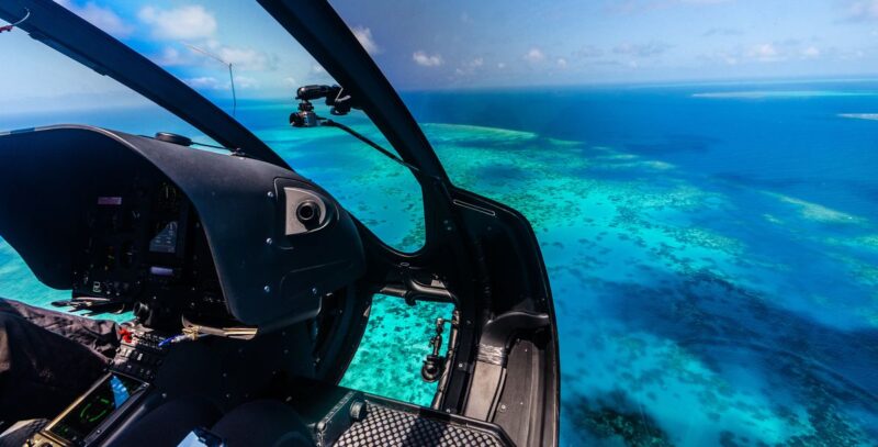 View of Great Barrier reef from Helicopter flying over it - one of the best things to do in Cairns