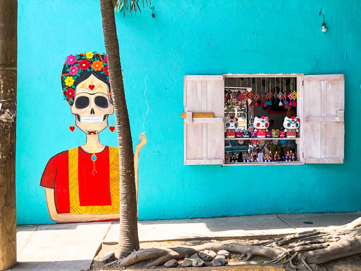 Colorful mural of a female skeleton on a wall in Sayulita, Mexico