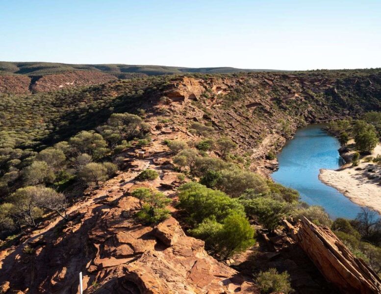 View over rocky landscape with scub busges and small pond at Kalbarri National Park - one of the best things to do on the West Coast of Australia