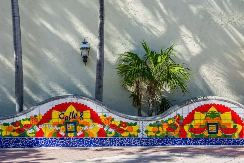 Colorful tile mosiac on wall with small palm tree in Miami