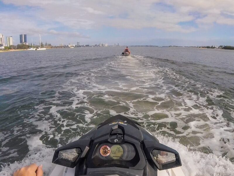 View of front of jetski and with another jetskier in front in the ocean near the Gold Coast