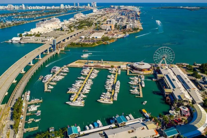 Aerial photo of Bayside Marketplace with boat marina and oversea road - a must visit during your 2 days in Miami