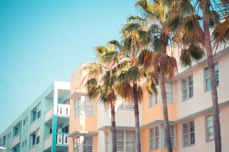 Colorful art deco buildings and palm trees in South Beach - a must visit during your 2 days in Miami