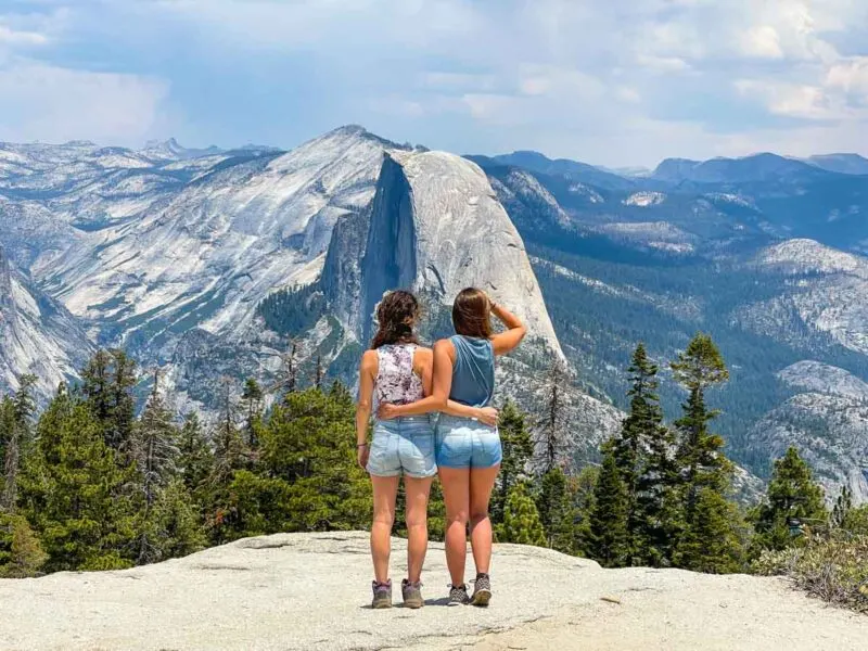 Women looking over the mountains on Yosemite road trip