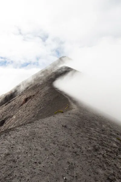 Fog over ridge on Fuego volcano near Antigua Guatemala