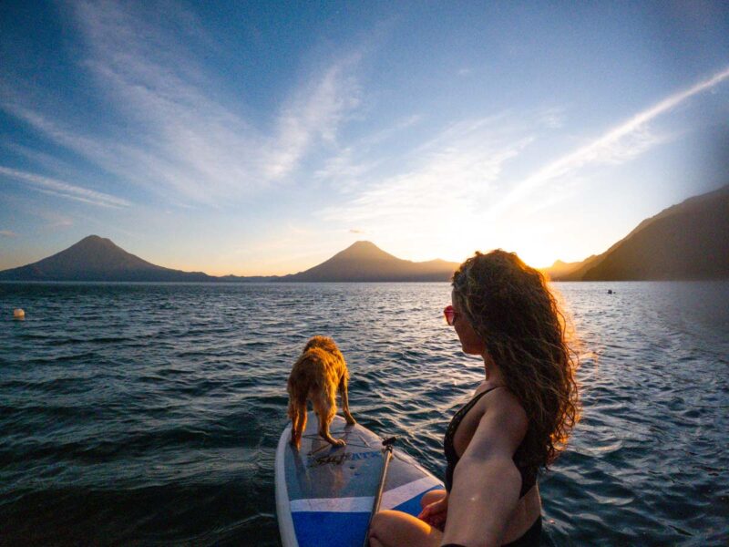 Woman and dog on SUP on Lake Atitlan in Guatemala