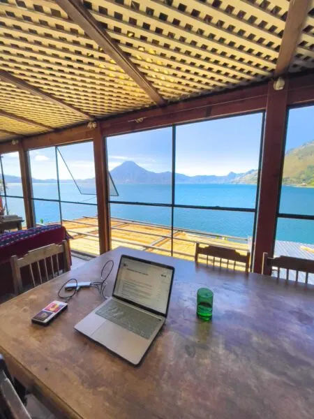 Laptop on desk with view of Lake Atitlan