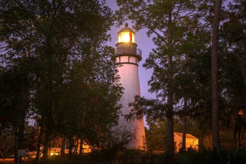Amelia Island Lighthouse through the trees for things to do in North Florida
