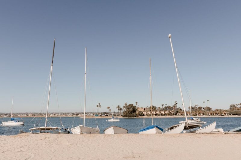 Sailboats on beach at Mission Bay on a San Diego itinerary