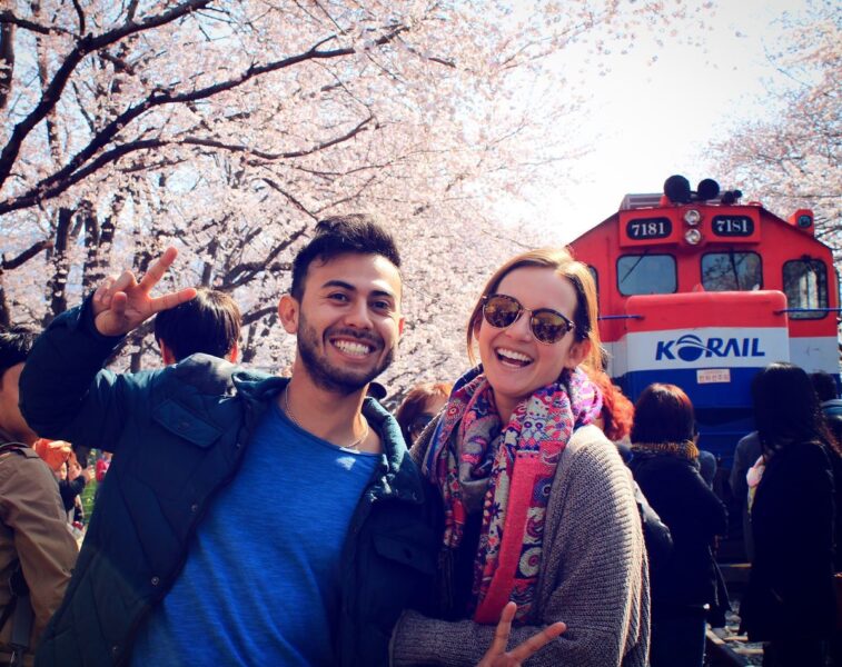 Couple at cherry blossom festival teaching English in South Korea