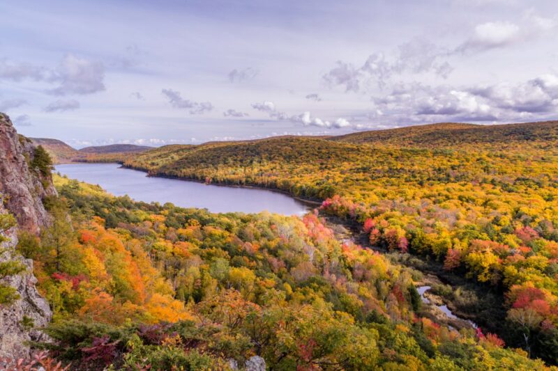 Lake and fall trees at Porcupine Mountains on hikes in Northern Michigan