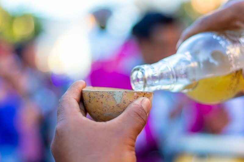 Pouring mezcal things to do in Oaxaca