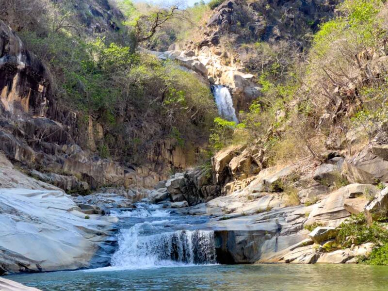 View of Cascada La Reforma through the rocks