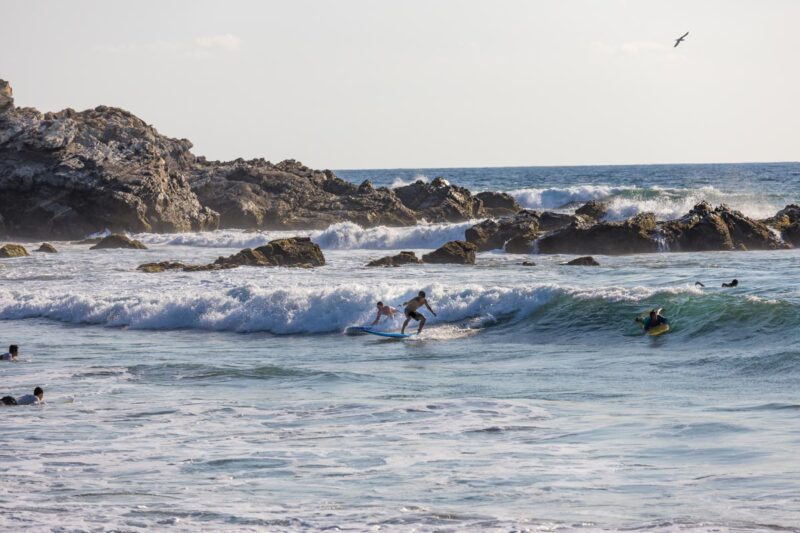 Surfers at La Punta Zicatela
