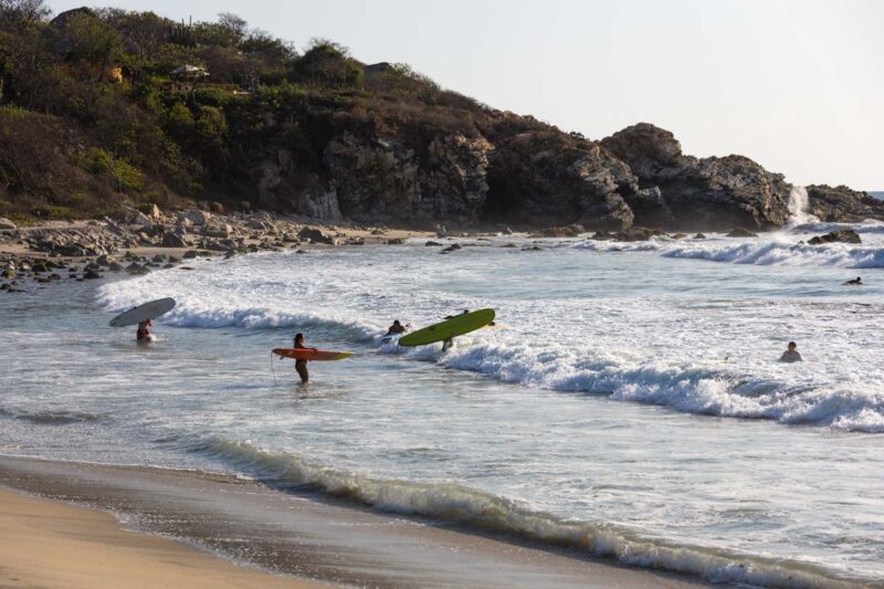 Surfers at La Punta best beaches in Puerto Escondido