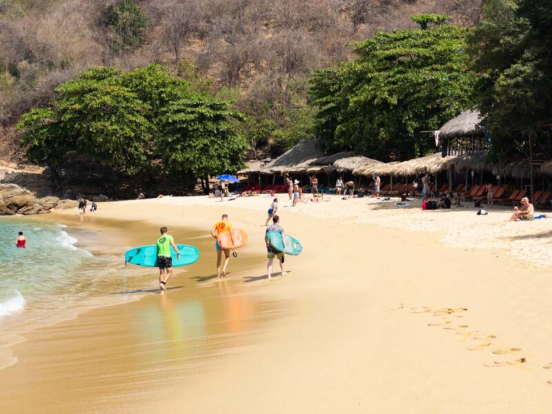 Surfers on Playa Carrizalillo - one of the best beaches in Puerto Escondido