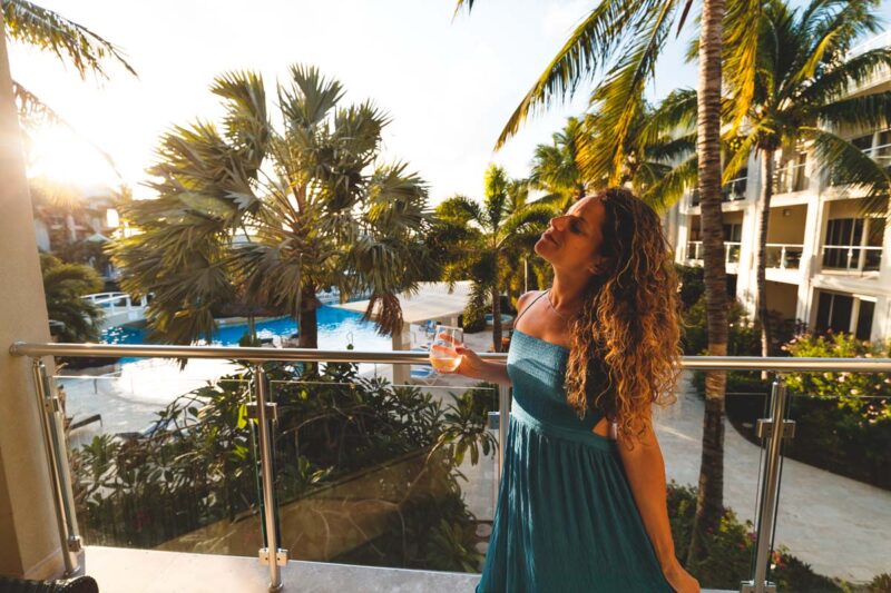 Woman on balcony at The Atrium where to stay in Turks and Caicos