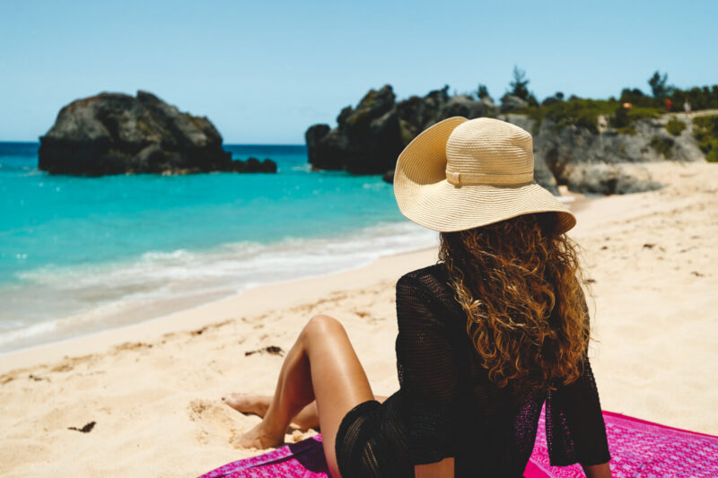 Woman on beach at Warwick Bay things to do in Bermuda