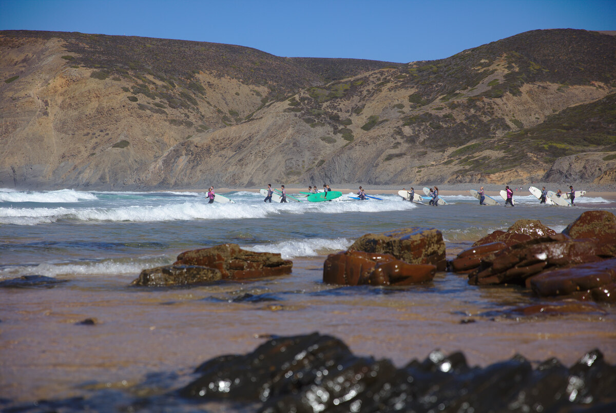 Surfers entering water on Algarve beaches