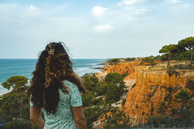 Woman at Praia da Falesia overlook beach in Albufeira