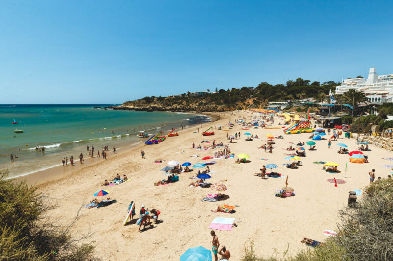 Sunbathers on Praia da Oura one of the best beaches in Albufeira