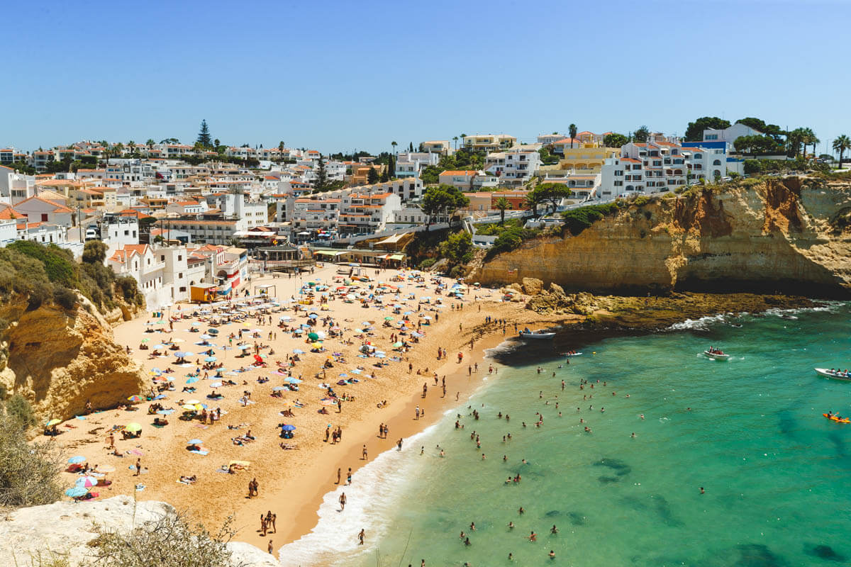 Crowds on Praia de Carvoiero on an Algarve itinerary
