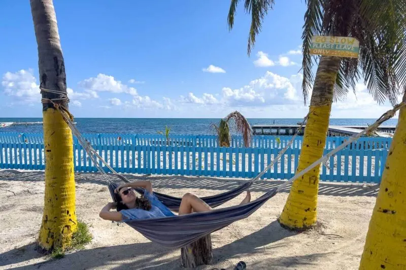 Leave time to lounge around in the hammocks at Caye Cauker Beach when planning a trip to Belize.