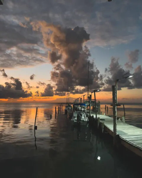 Sunset over jetty at Caye Caulker for things to do in Belize