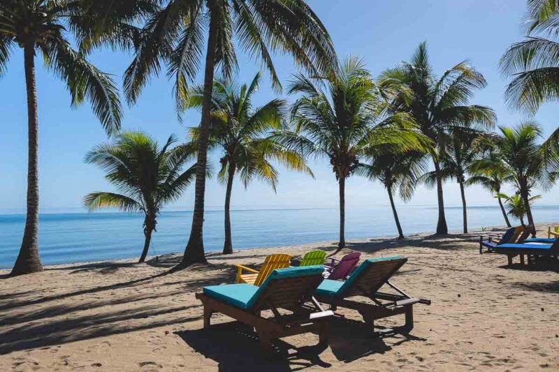 Sunloungers on Hopkins Beach one of the best beaches in Belize