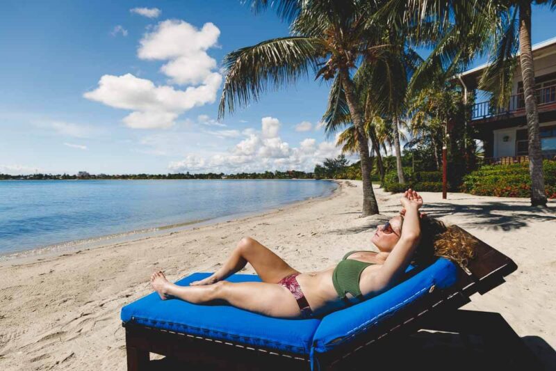 Woman on sunlounger one of the best things to do in Belize