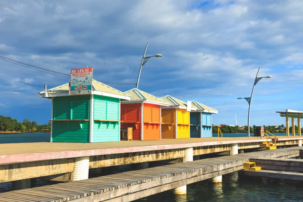 Colorful buildings on Placencia Pier for things to do in Belize