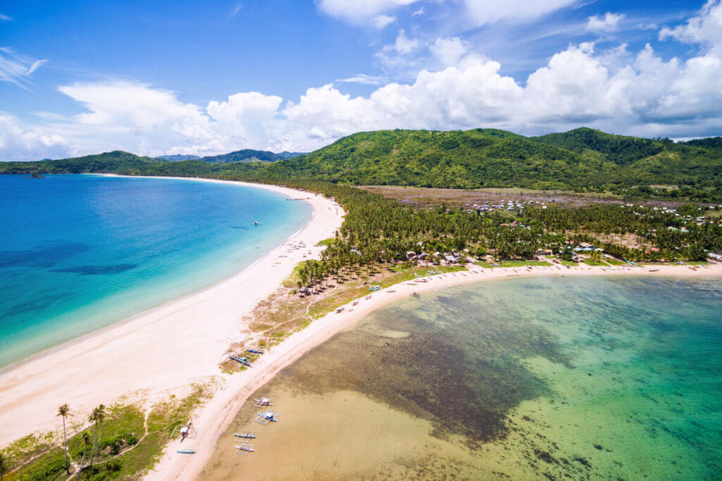 Nacpan Beach is the perfect spot to go for island hopping in El Nido.